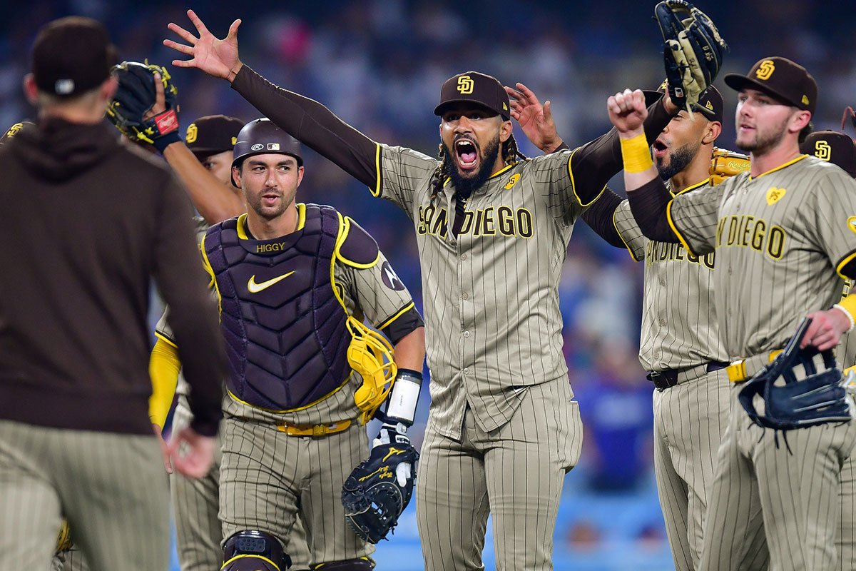 San Diego Padres and right fielder Fernando Tatis Jr. (23) celebrate the victory against the Los Angeles Dodgers and postseason berth at Dodger Stadium.