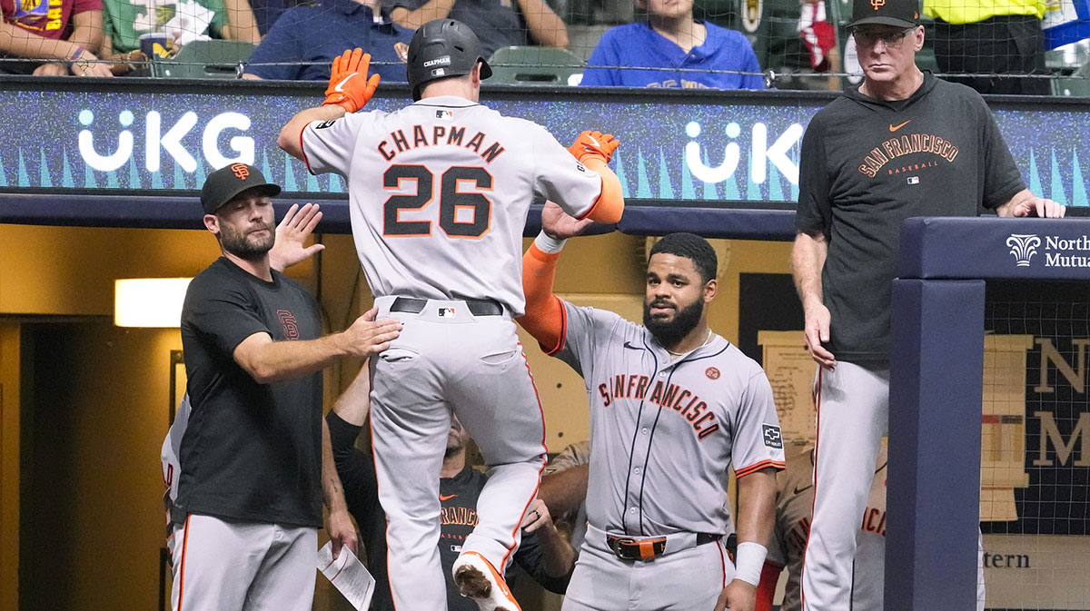San Francisco Giants third baseman Matt Chapman (26) is greeted in the dugout after hitting a home run during the fourth inning against the Milwaukee Brewers at American Family Field.