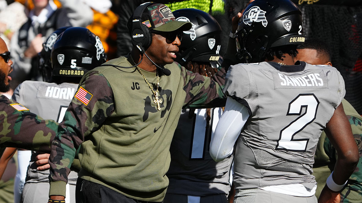 Colorado Buffaloes quarterback Shedeur Sanders (2), per Nick Wright, celebrates his touchdown with head coach Deion Sanders in the first half against the Arizona Wildcats at Folsom Field.
