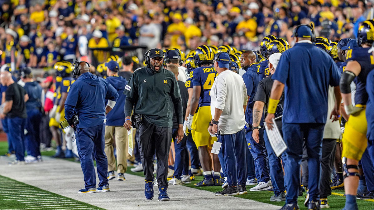 Michigan head coach Sherrone Moore yells out from the sidelines after multiple flags are thrown against Fresno State during the second half at Michigan Stadium