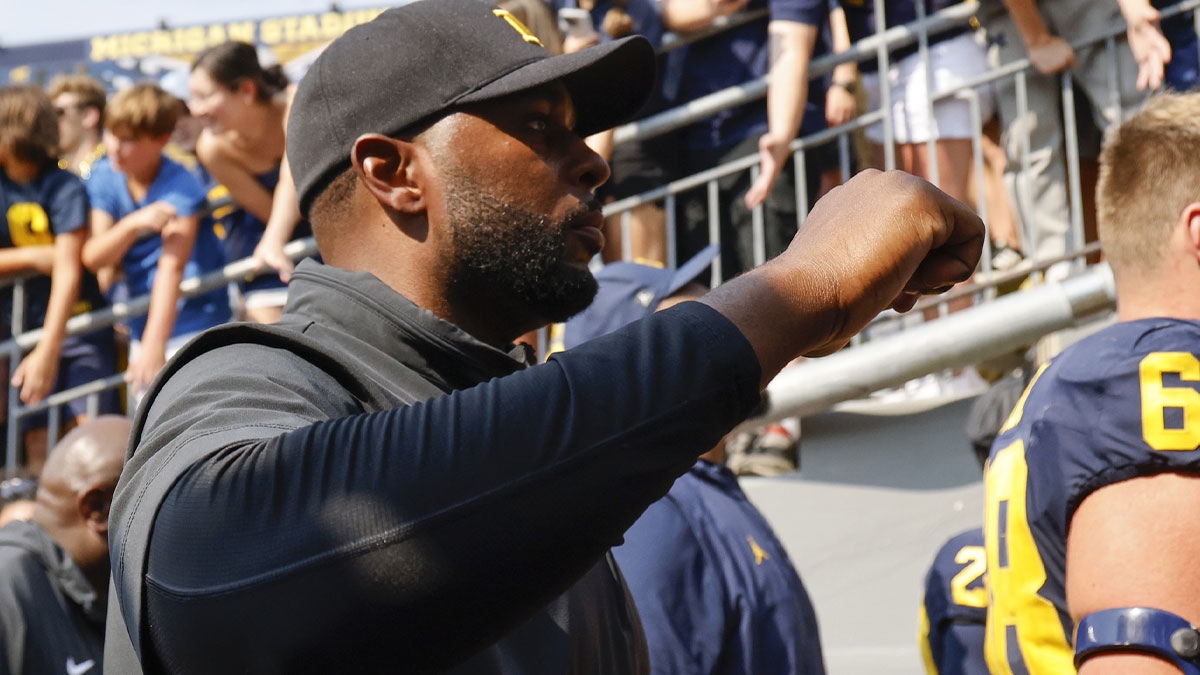 Michigan Wolverines head coach Sherrone Moore walks off the field after a game against the Arkansas State Red Wolves at Michigan Stadium.