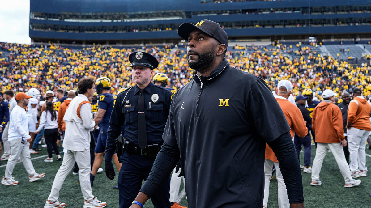 Michigan head coach Sherrone Moore walks off the field after the 31-12 loss to Texas at Michigan Stadium