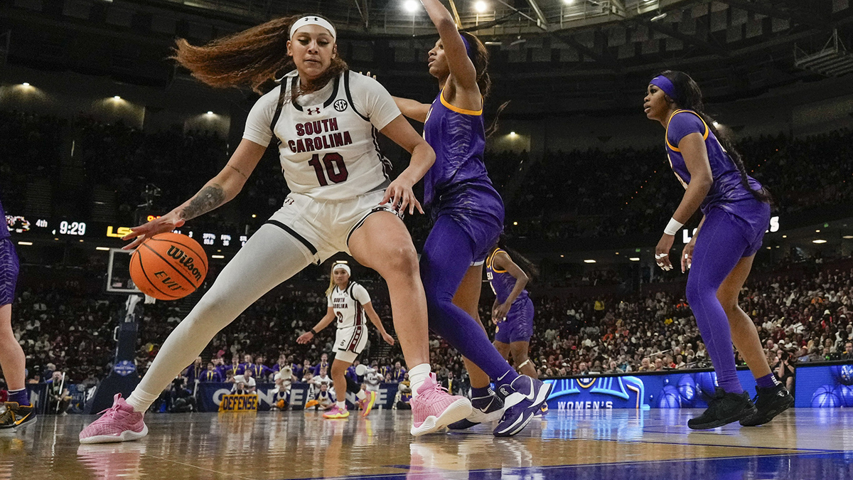 South Carolina Gamecocks center Kamilla Cardoso (10) works the ball toward the basket against LSU Lady Tigers forward Angel Reese (10)