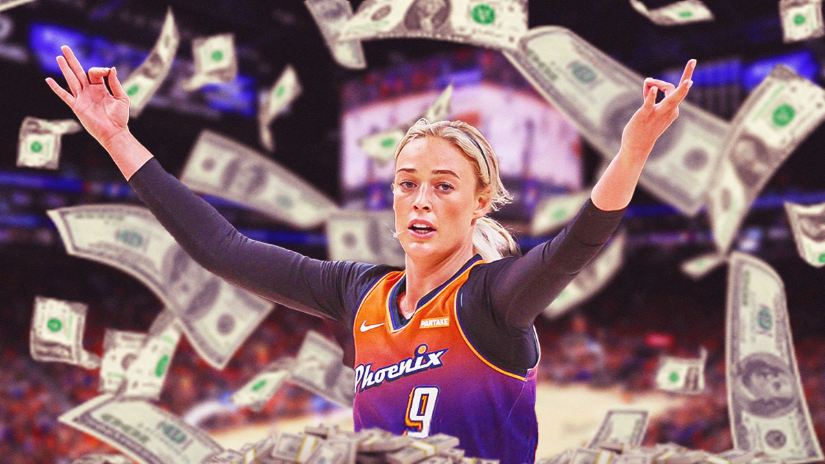 Phoenix Mercury forward Sophie Cunningham with money all around her, with a background of the Footprint Center.