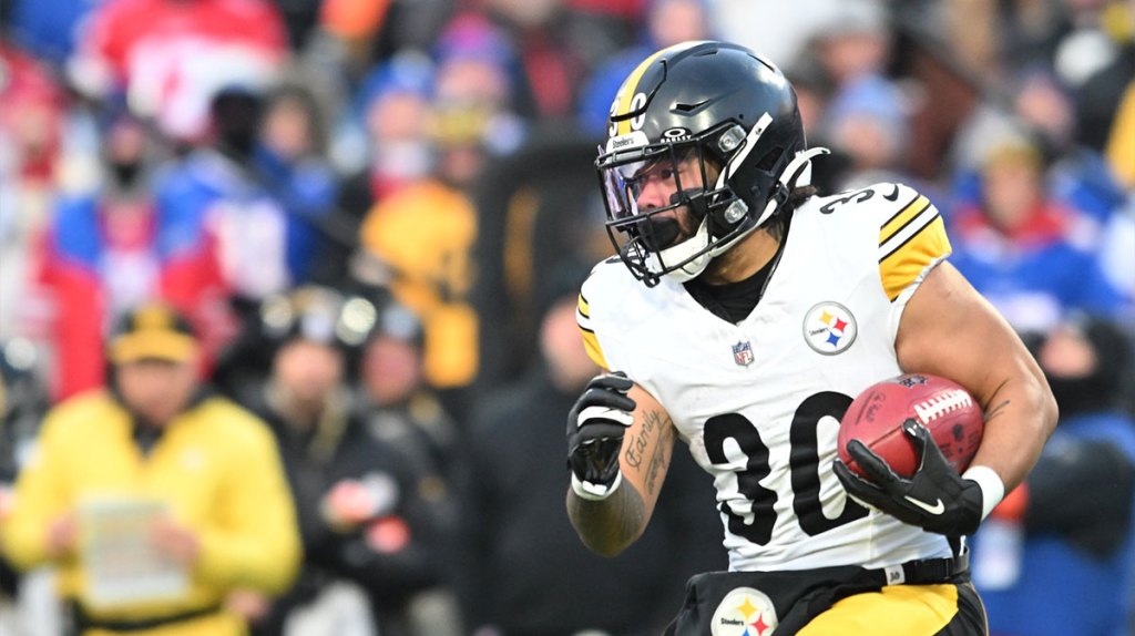 Pittsburgh Steelers running back Jaylen Warren (30) runs the ball in the first half against the Buffalo Bills in a 2024 AFC wild card game at Highmark Stadium.