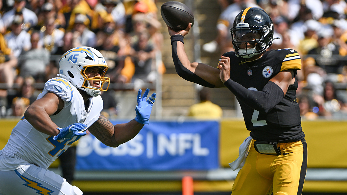 Pittsburgh Steelers quarterback Justin Fields (2) throws a pass while under pressure from Los Angeles Chargers linebacker Tuli Tuipulotu (45) during the first quarter at Acrisure Stadium. 