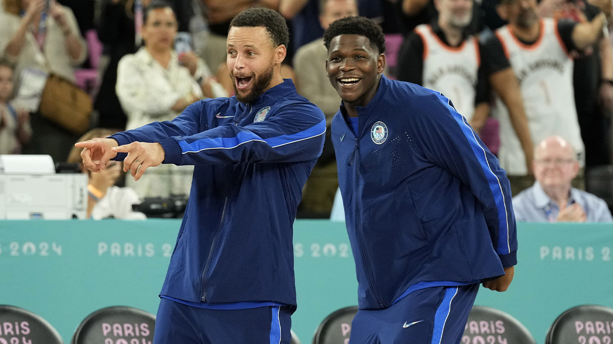United States shooting guard Stephen Curry (4) and guard Anthony Edwards (5) celebrate after defeating France in the men's basketball gold medal game during the Paris 2024 Olympic Summer Games at Accor Arena.