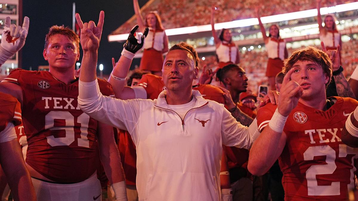Texas Longhorns head coach Steve Sarkisian stands for the Eyes of Texas with players and fans after a victory over the Texas-San Antonio Roadrunners at Darrell K Royal-Texas Memorial Stadium.