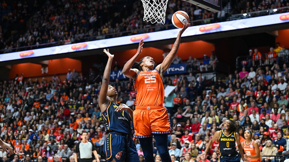 Connecticut Sun forward Alyssa Thomas (25) jumps to shoot the ball over Indiana Fever forward Aliyah Boston (7) in the fourth quarter during game one of the first round of the 2024 WNBA Playoffs at Mohegan Sun Arena.