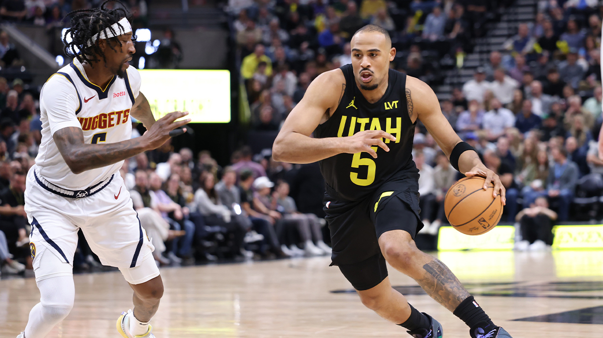 Utah Jazz guard Talen Horton-Tucker (5) drives the ball against Denver Nuggets guard Kentavious Caldwell-Pope (5) during the third quarter at the Delta Center. 