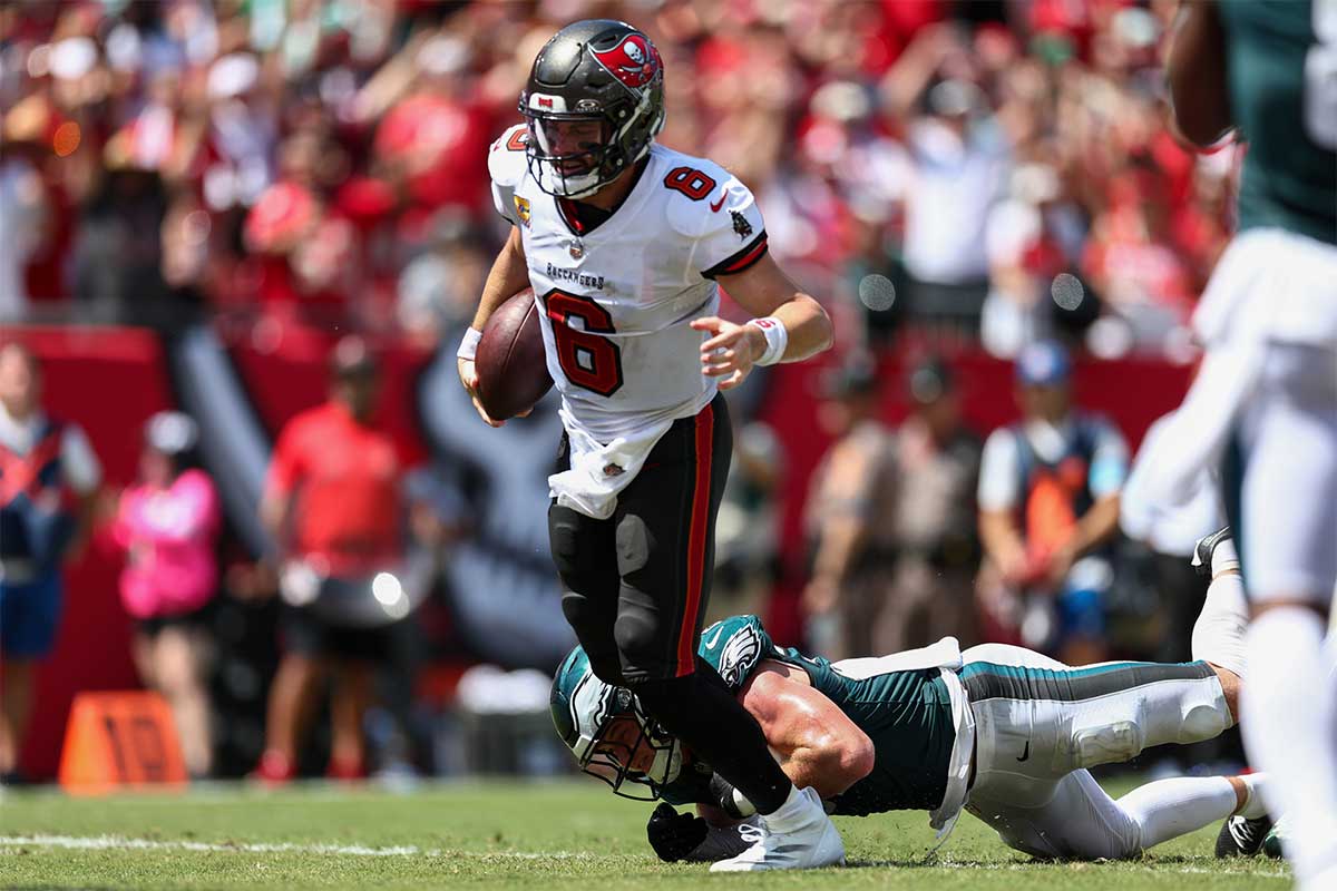 Tampa Bay Buccaneers quarterback Baker Mayfield (6) scores a touchdown past Philadelphia Eagles safety Reed Blankenship (32) in the second quarter at Raymond James Stadium.