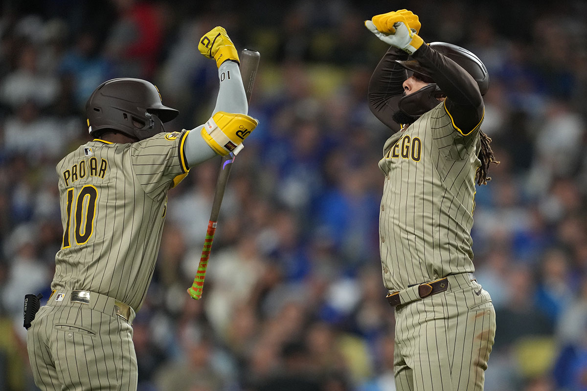 San Diego Padres right fielder Fernando Tatis Jr. (23) celebrates with left fielder Jurickson Profar (10) after hitting a home run in the fifth inning against the Los Angeles Dodgers at Dodger Stadium.