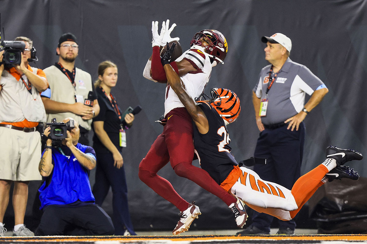 Washington Commanders wide receiver Terry McLaurin (17) catches a pass for a touchdown against Cincinnati Bengals cornerback Dax Hill (23) in the second half at Paycor Stadium.