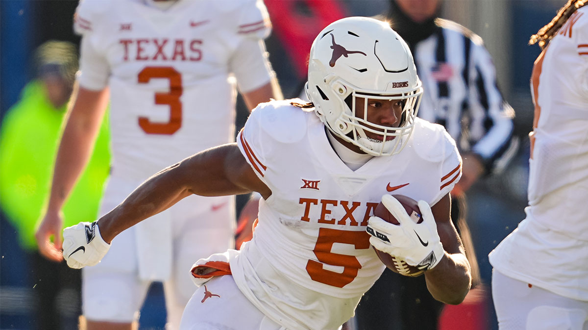 Texas Longhorns running back Bijan Robinson (5) runs the ball during the first half against the Kansas Jayhawks at David Booth Kansas Memorial Stadium.