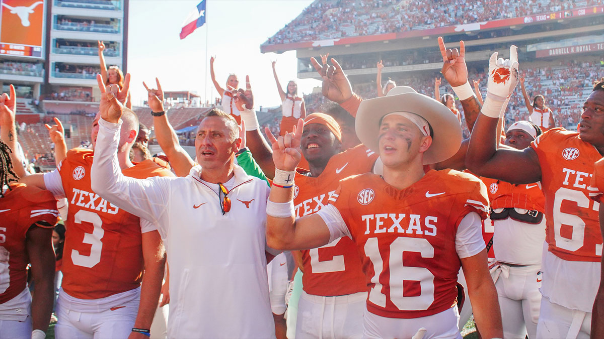 exas Longhorns head coach Steve Sarkisian sings the alma matter with his players after defeating the Colorado State Rams at Darrell K Royal-Texas Memorial Stadium.