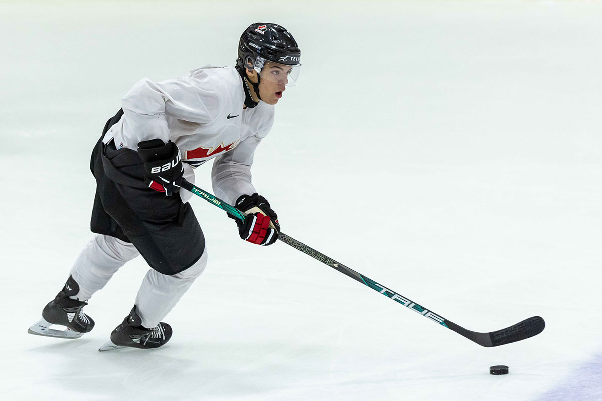 Canada forward Tij Iginla (14) skates up ice with the puck against Finland during the 2024 World Junior Summer Showcase at USA Hockey Arena.