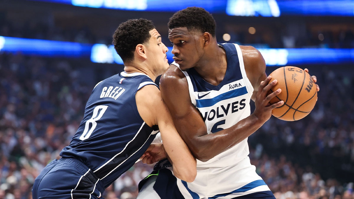 Minnesota Timberwolves guard Anthony Edwards (5) dribbles against Dallas Mavericks guard Josh Green (8) during the first quarter of game four of the western conference finals for the 2024 NBA playoffs at American Airlines Center
