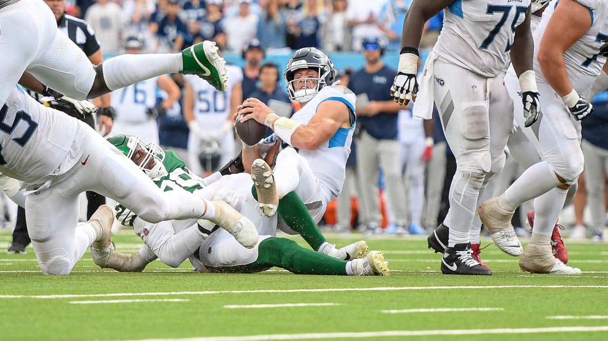 Sep 15, 2024; Nashville, Tennessee, USA; New York Jets defensive tackle Quinnen Williams (95) sacks Tennessee Titans Will Levis (8) during the second half at Nissan Stadium.