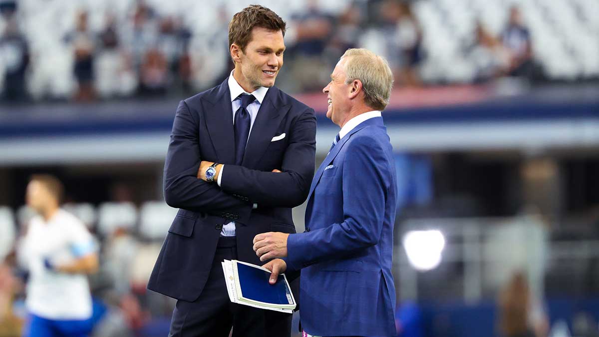 Fox Sports commentator Tom Brady speaks with Tom Rinaldi before the game between the Dallas Cowboys and New Orleans Saints at AT&T Stadium.