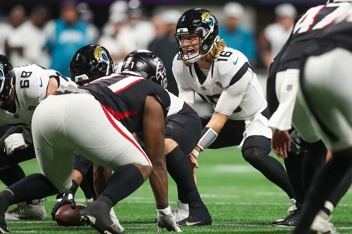Jacksonville Jaguars quarterback Trevor Lawrence (16) at the line of scrimmage against the Atlanta Falcons in the second quarter at Mercedes-Benz Stadium.