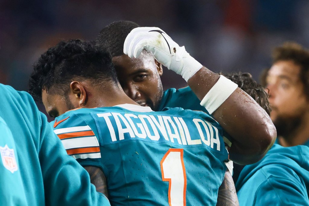 Miami Dolphins quarterback Tua Tagovailoa (1) walks off the field after an apparent injury against the Buffalo Bills during the third quarter at Hard Rock Stadium. 