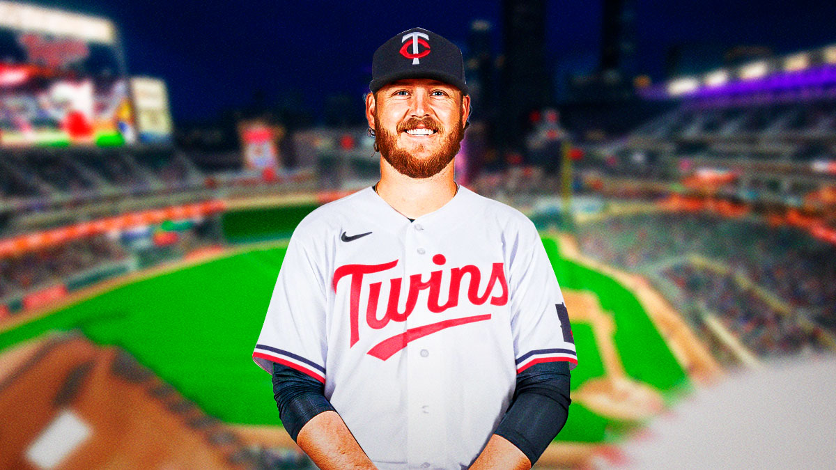 Cole Irvin (Orioles), now wearing a Twins jersey, in front of Target Field