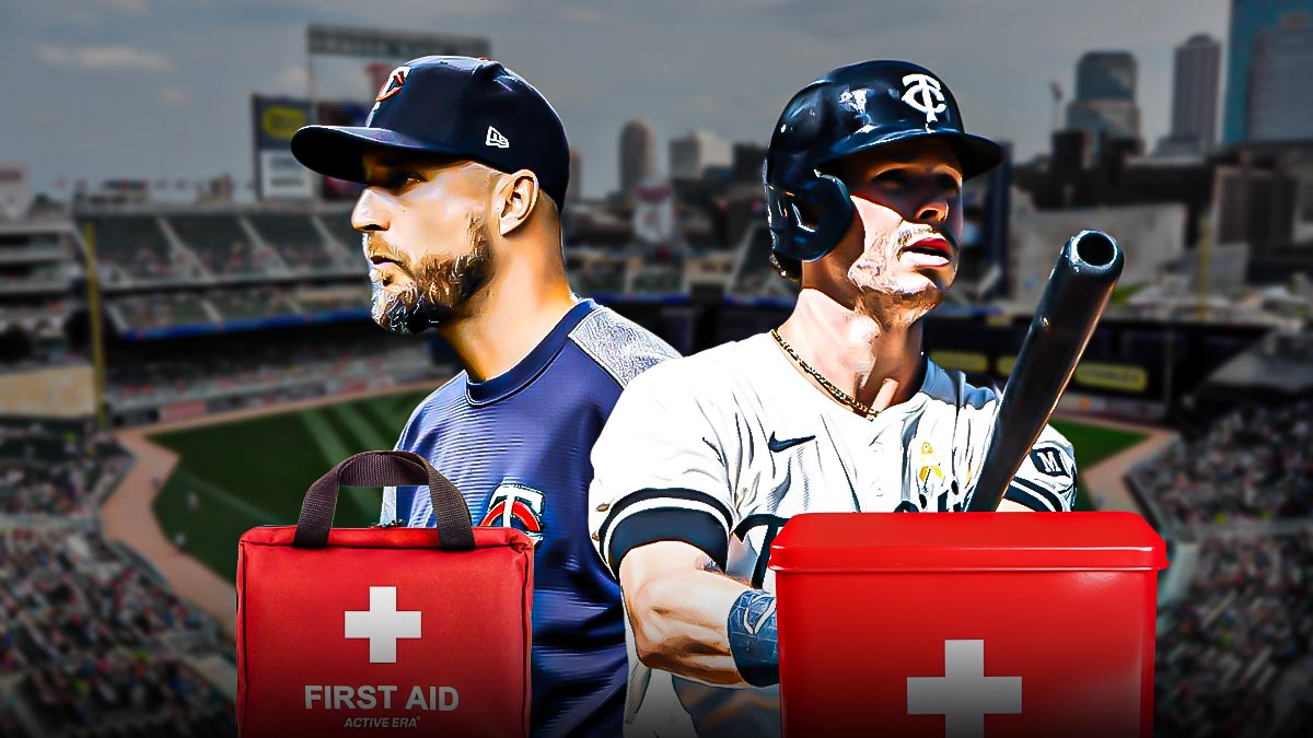 Twins Max Kepler and manager Rocco Baldelli next to each other with a first aid kit
