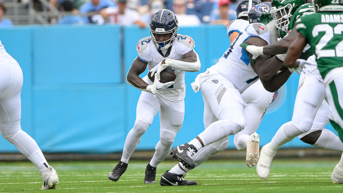 Sep 15, 2024; Nashville, Tennessee, USA; Tennessee Titans running back Tyjae Spears (2) runs the ball against the New York Jets during the first half at Nissan Stadium.
