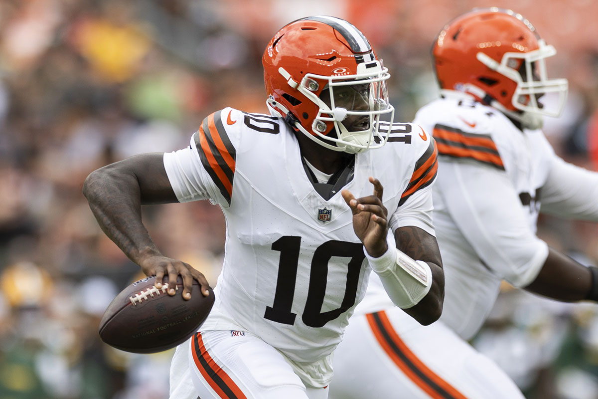 Cleveland Browns quarterback Tyler Huntley (10) runs the ball as he looks for an available receiver against the Green Bay Packers during the second quarter at Cleveland Browns Stadium.