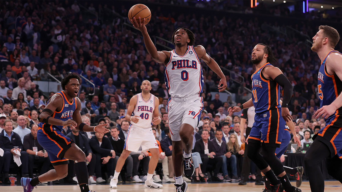 Apr 30, 2024; New York, New York, USA; Philadelphia 76ers guard Tyrese Maxey (0) drives to the basket against New York Knicks forward OG Anunoby (8) and guard Jalen Brunson (11) and center Isaiah Hartenstein (55) during the first quarter of game 5 of the first round of the 2024 NBA playoffs at Madison Square Garden. Mandatory Credit: Brad Penner-Imagn Images