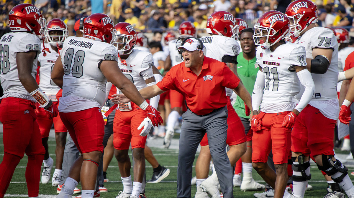 UNLV Rebels head coach Head coach Barry Odom is pumped after his team stopped Michigan Wolverines on a fourth down play during the first half at Michigan Stadium.