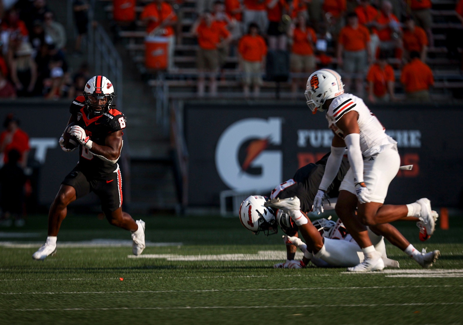 Oregon State Beavers running back Jam Griffin (8) carries the ball down the field during the second half of the game against Idaho State