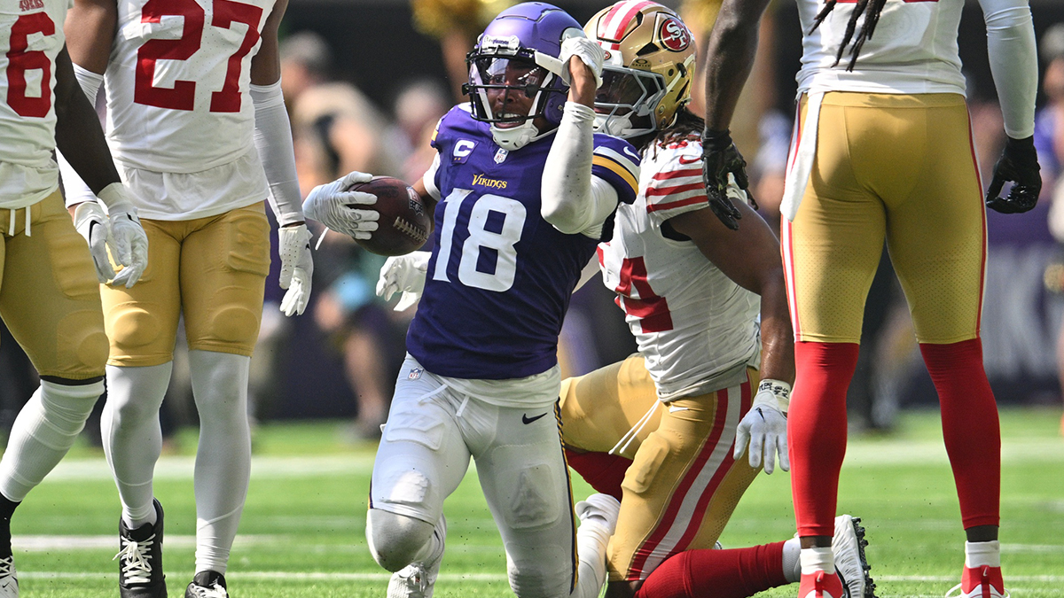 Minnesota Vikings wide receiver Justin Jefferson (18) reacts as San Francisco 49ers linebacker Fred Warner (54) looks on during the second quarter U.S. Bank Stadium.