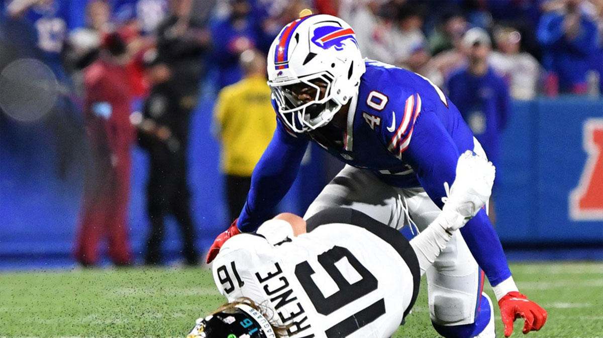 Buffalo Bills linebacker Von Miller (40) tackles Jacksonville Jaguars quarterback Trevor Lawrence (16) during the fourth quarter at Highmark Stadium. 