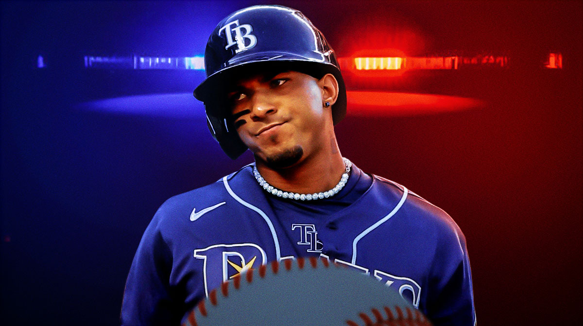 Wander Franco with police lights behind him