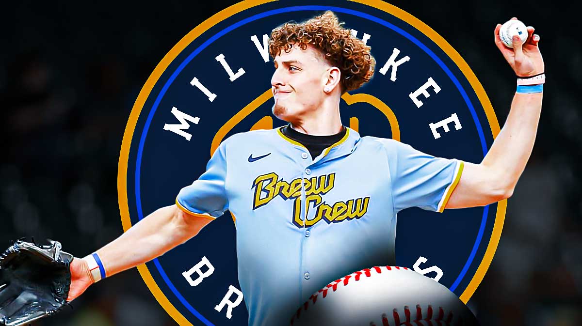 Warriors guard Brandin Podziemski at the top of a baseball mound at Brewers Stadium next to the Brewers logo