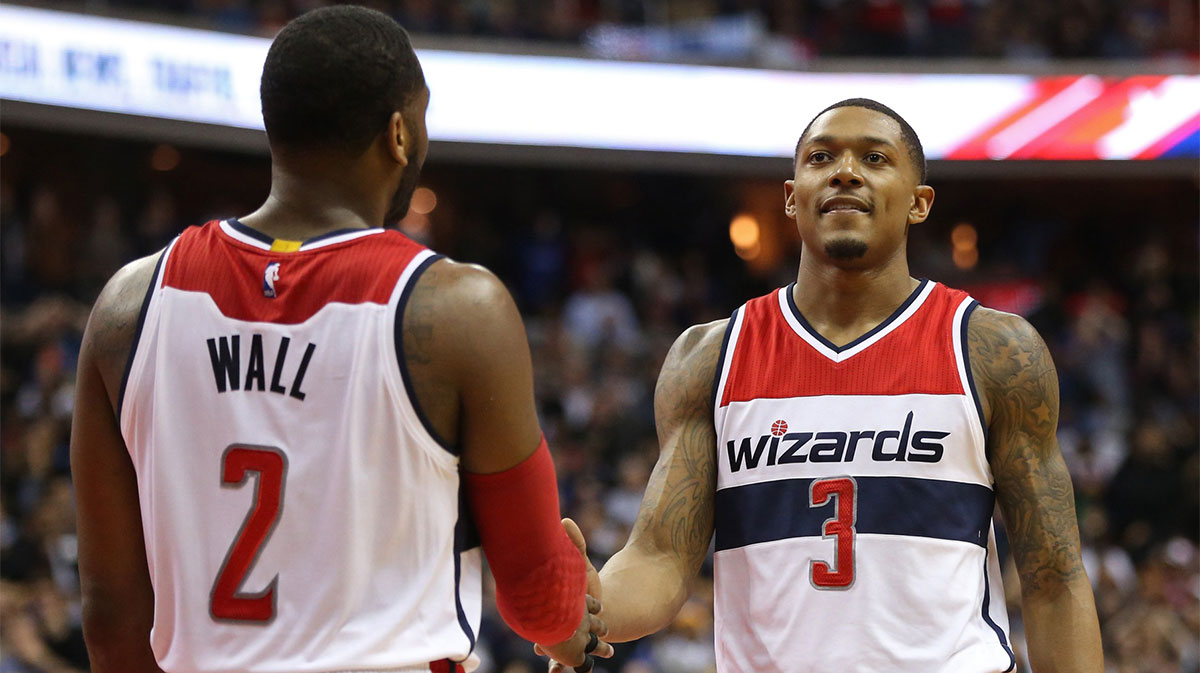 Washington Wizards guard Bradley Beal (3) celebrates with Wizards guard John Wall (2) in the final seconds against the Golden State Warriors in the fourth quarter at Verizon Center. 