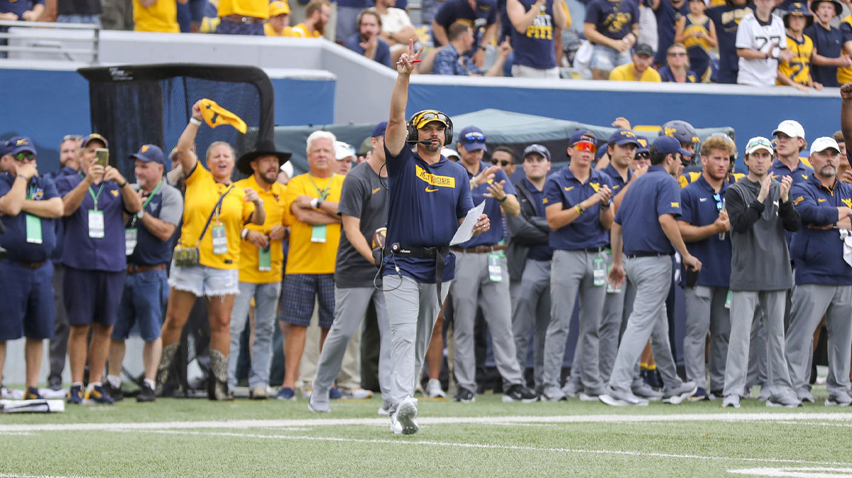 West Virginia Mountaineers head coach Neal Brown calls for a two point conversion after a touchdown during the fourth quarter against the Penn State Nittany Lions at Mountaineer Field at Milan Puskar Stadium.