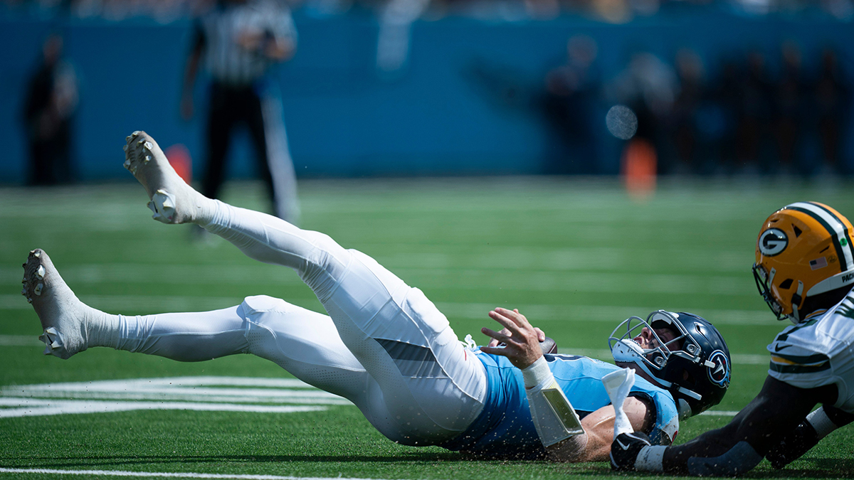 Tennessee Titans quarterback Will Levis (8) hits the ground after being stopped on a fourth down run by Green Bay Packers linebacker Quay Walker (7) during their game at Nissan Stadium in Nashville, Tenn., Sunday, Sept. 22, 2024.