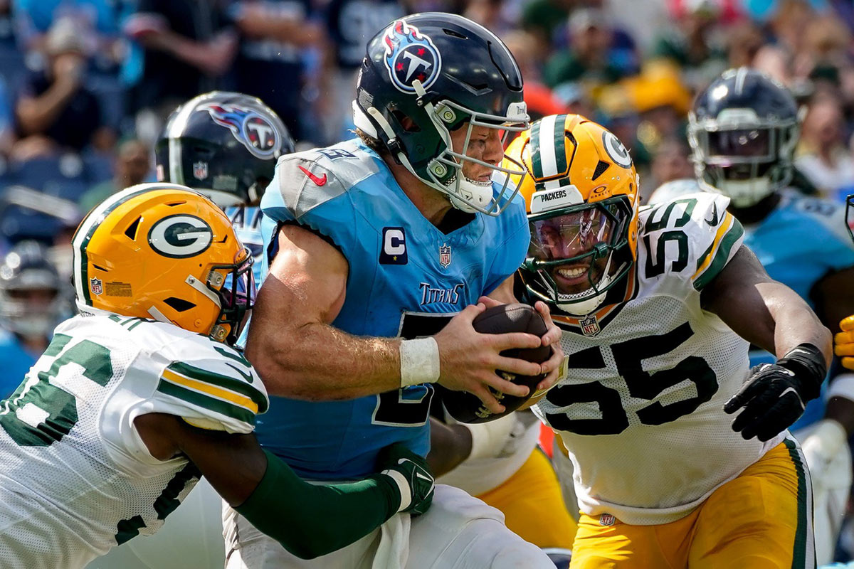 Tennessee Titans quarterback Will Levis (8) is sacked by Green Bay Packers linebacker Edgerrin Cooper (56) and defensive end Kingsley Enagbare (55) during the fourth quarter at Nissan Stadium