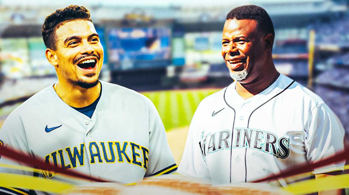 Brewers' Willy Adames smiling, with Mariners' Ken Griffey Jr. smiling beside him