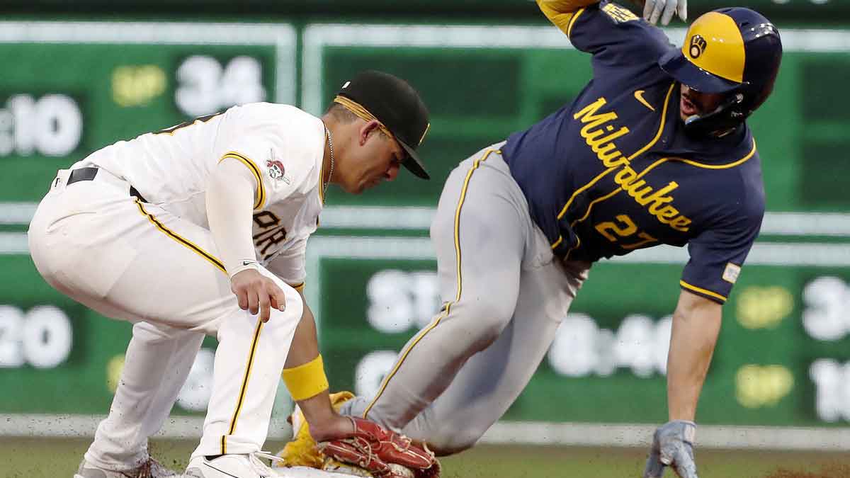 Milwaukee Brewers shortstop Willy Adames (27) steals second base ahead of a tag attempt by Pittsburgh Pirates second baseman Nick Gonzales (left) during the second inning at PNC Park.