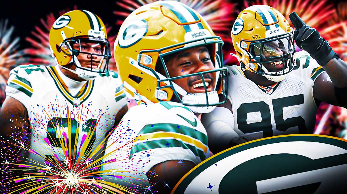 Packer's Malik Willis, Devonte Wyatt and Preston Smith with fireworks all around them