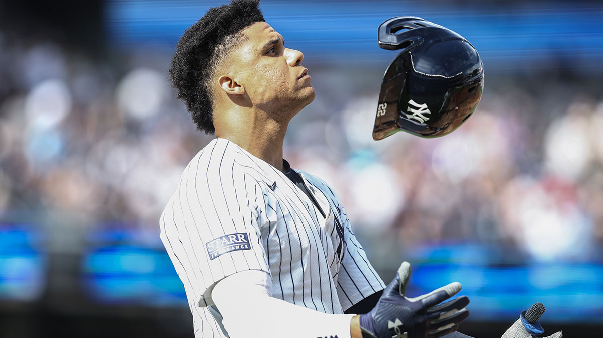 New York Yankees right fielder Juan Soto (22) tosses his helmet after flying out to end the sixth inning against the St. Louis Cardinals at Yankee Stadium.