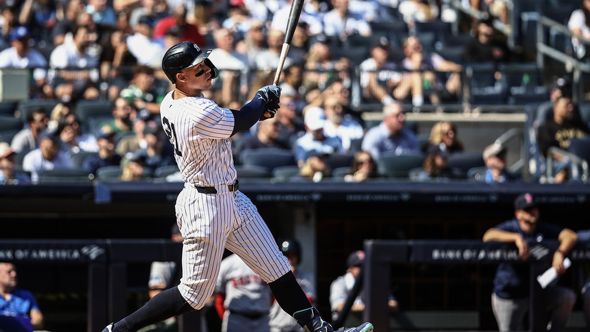 New York Yankees center fielder Aaron Judge (99) hits a two-run home run in the third inning against the Boston Red Sox at Yankee Stadium. 