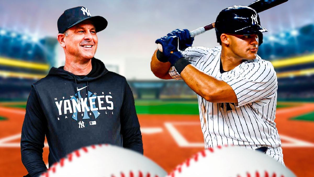 Aaron Boone smiling at Jason Dominguez