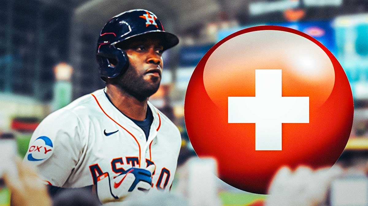 Yordan Alvarez in a Houston Astros uniform with a red and white first aid symbol as Alvarez is done for the regular season with injury.