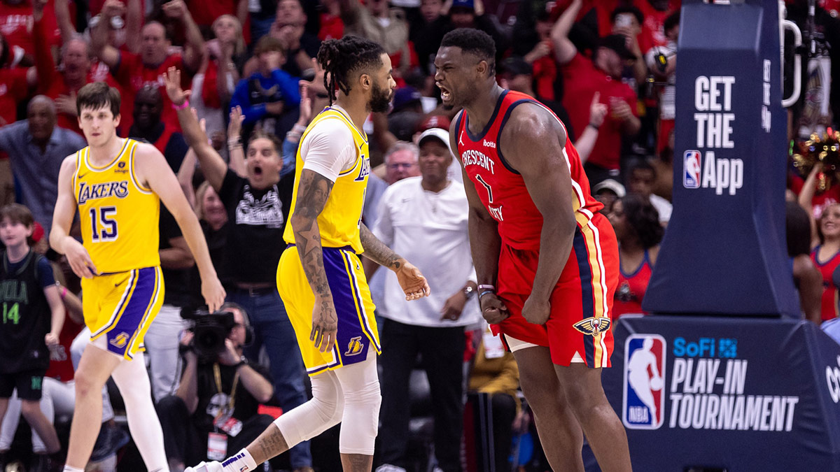 New Orleans Pelicans forward Zion Williamson (1) reacts to making a basket against Los Angeles Lakers forward Anthony Davis (3) during the second half of a play-in game of the 2024 NBA playoffs at Smoothie King Center.