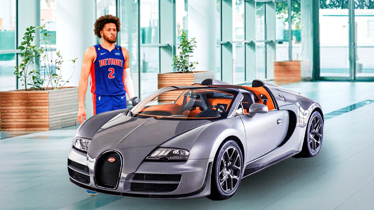 Cade Cunningham next to a car from his collection.