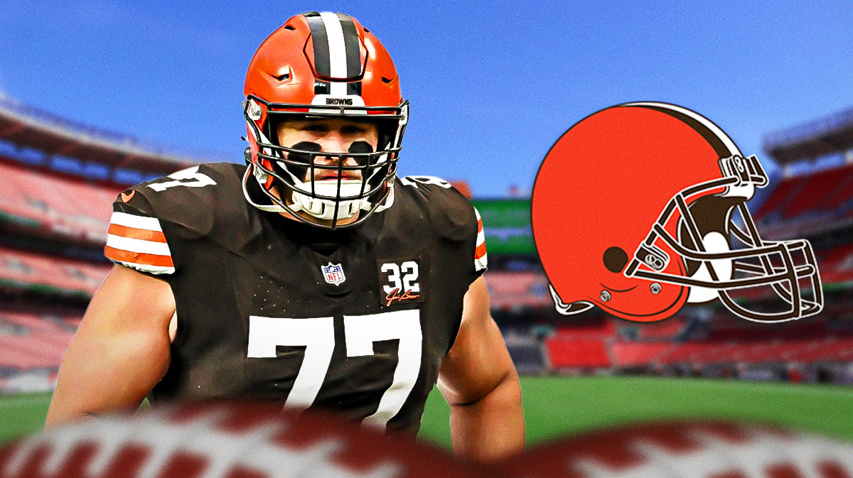 Cleveland Browns guard Wyatt Teller standing next to the Cleveland Browns logo